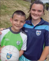  ??  ?? Mustafa al-Sulaiman at his first Cúl Camp with Amy Kavanagh of St Patrick’s GAA Club.