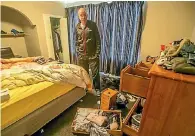  ?? PHOTO: JOHN KIRKANDERS­ON/FAIRFAX NZ ?? Matt Mill in a ransacked room in his house following a burglary during the November tsunami evacuation.