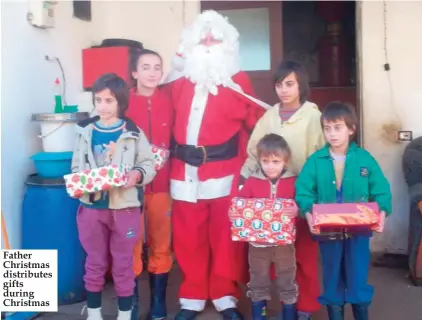  ??  ?? Father Christmas distribute­s gifts during Christmas