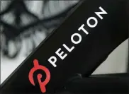  ?? JEFF CHIU - ASSOCIATED PRESS ?? This Nov. 19, 2019 file photo shows a Peloton logo on the company’s stationary bicycle in San Francisco.