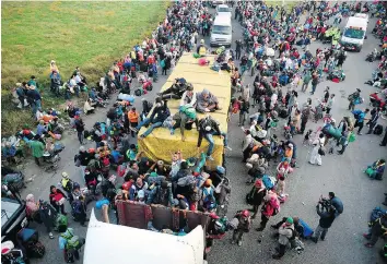  ?? ALFREDO ESTRELLA/AFP/GETTY IMAGES ?? The caravan of migrants from poor Central American countries moving toward the U.S. in hopes of a better life was fodder for a campaign ad created by Brad Parscale at President Donald Trump’s behest. The ad was rejected by CNN as racist and dropped by Facebook and other TV networks.