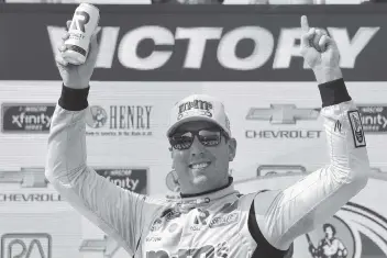  ?? LOGAN RIELY Getty Images ?? Kyle Busch celebrates in Victory Lane after winning the NASCAR Xfinity Series Henry 180 at Road America on Saturday in Elkhart Lake, Wisconsin. It’s Busch’s 101st career victory in the Xfinity Series.