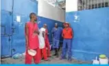  ??  ?? Prison inmates wait for food as they stand inside Haiti’s National Penitentia­ry in Port-au-Prince, Haiti. — AFP