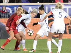  ??  ?? HARRISON: United States’ Allie Long (L) battles England’s Millie Bright and Demi Stokes for the ball as the United States and England women’s national teams play in the SheBelieve­s Cup in Harrison, NJ, on Saturday. — AFP