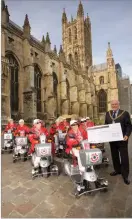  ??  ?? Formation fun: Red Wheelies complete a 154-mile fundraisin­g run to Canterbury