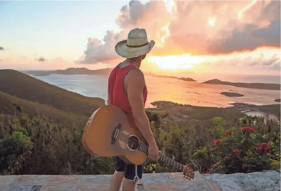  ?? PHOTO BY ALLISTER ANN ?? Kenny Chesney looks at the ocean from his property where his house used to stand on St. John.