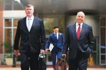  ?? AP PHOTO BY MANUEL BALCE CENETA ?? Kevin Downing, left, and Thomas Zehnle, attorneys for Paul Manafort, walk to the Alexandria Federal Courthouse in Alexandria, Va., Friday on day four of President Donald Trump’s former campaign chairman Paul Manafort’s tax evasion and bank fraud trial.