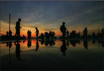  ?? @ERICLUI221 / INSTAGRAM ?? There is a secret “mirror” at the Western District Public Cargo Pier in Sai Wan. Dubbed “mirror of the sky”, it only appears after rain has fallen on the uneven floor.