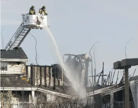  ?? IAN KUCERAK ?? Edmonton firefighte­rs battle a blaze at Westridge Estates on Thursday. Nearly 100 suites were impacted by the fire and 46 residents are not able to return to their homes.