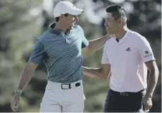  ?? ?? 0 Rory Mcilroy and Collin Morikawa celebrate on the 18th