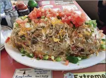  ?? LIGAYA FIGUERAS/LFIGUERAS@AJC.COM PHOTOS ?? To fuel up before tramping around the Hoh rainforest on the Olympic Peninsula, Ligaya Figueras and her family stopped at Marcia’s Silver Spoon Cafe, an old-school diner in Tacoma. Pictured is the Silver Spoon Scramble, a massive mound of hash browns mixed with scrambled eggs, diced ham, onions, bell peppers, tomatoes and shredded cheese.