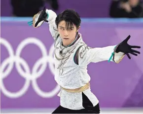  ?? DAVID J. PHILLIP/AP ?? Yuzuru Hanyu of Japan performs during the men’s free figure skating final Saturday in the Gangneung Ice Arena.