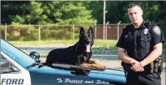  ?? New Milford Police Department / Contribute­d photo ?? K-9 Kira with her handler, Sgt. Michael Lafond.