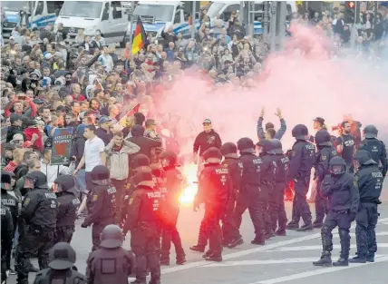  ?? Photo / AP ?? Police were caught off guard when far-right protesters gathered in Chemnitz this week.
