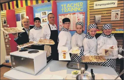  ??  ?? STUDENTS have been cooking up a storm to launch an educationa­l community hub in an empty shop unit in the city centre.
Catering students from City College Peterborou­gh rustled up canapes for the civic dignatorie­s who attended the official opening of...