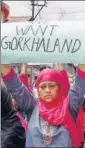  ?? PTI ?? A woman displays a placard with the demand for Gorkhaland state during a silent peace rally in Darjeeling on Sunday.