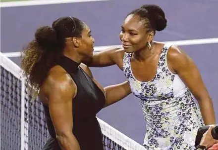  ?? EPA PIC ?? Venus Williams (right) hugs her sister Serena after defeating her in the Indian Wells tournament on Sunday.