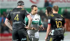  ??  ?? The last moment for Johnny Fa’auli, second from right, in Chiefs colours was this red card for his high shot on Hurricanes centre Wes Goosen last Friday.