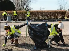  ?? DANA JENSEN THE DAY ?? Kaira Wilshire, left, Gracie Todisco and fellow volunteers from the Stonington High School student government pick up trash along Bayview Avenue in Stonington during the Trash Talk Rally 2 on Saturday.