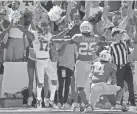  ?? BRYAN TERRY/THE OKLAHOMAN ?? OU's Marvin Mims (17) celebrates a TD beside Texas' B.J. Foster (25) and Darion Dunn.
