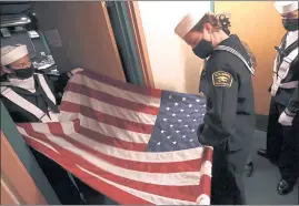  ?? ?? United States Naval Sea Cadets prepare the flag at the Henry J. Mello Center for the Performing Arts before Thursday’s Veterans Day ceremony.