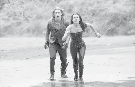  ??  ?? Wil (Austin Butler) and Amberle (Poppy Drayton) face off against a demon in The Shannara Chronicles, airing tonight on MTV.