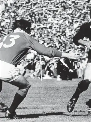  ??  ?? All Black first-five Doug Bruce looks for space as he is challenged by Ian McGeech h