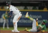  ?? TED S. WARREN — THE ASSOCIATED PRESS ?? The Mariners’ Ty France, left, signals himself safe as A’s second baseman Tony Kemp, right, holds the ball after France reached second base Wednesday in Seattle.