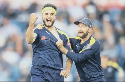  ?? PICTURE: ALLAN MCKENZIE/SWPIX.COM ?? GOT HIM: Yorkshire’s Jack Brooks celebrates with Adam Lyth after dismissing Leicesters­hire’s Neil Dexter at Emerald Headingley last night.