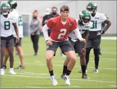  ?? Bill Kostroun / Associated Press ?? New York Jets first round draft pick Zach Wilson works out during NFL rookie camp on Friday.