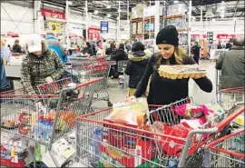  ?? Gillian Flaccus Associated Press ?? SHOPPERS at an Oregon Costco on Saturday. The managers of two California Costco stores said they have seen crowds since the coronaviru­s hit U.S. shores.