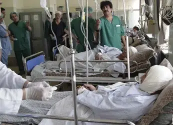  ?? RAHMAT GUL/THE ASSOCIATED PRESS ?? A suicide attack in Kabul killed at least 14 and wounded others on Monday.