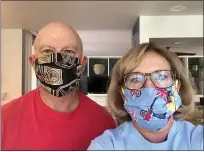  ?? PHOTO COURTESY OF DIANE BURNELL ?? Marilyn Fonock, right, and her husband Rob, of Phoenixvil­le, wear handmade masks sewn by Marilyn’s sister Diane Burnell. While masks can help prevent the spread of infection, officials caution that other measure must be followed to avoid COVID-19.