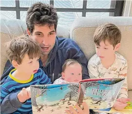  ?? Photo contribute­d by Andrew Ginsburg ?? Southport comedian Andrew Ginsburg reads to his three kids. Ginsburg has made a hobby of sending letters to the editor, all 150 words or less, to newspapers across the country.