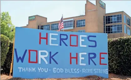  ?? Jeremy Stewart ?? A sign at the corner of Turner Mccall Boulevard and North Second Avenue honors the staff and doctors at Floyd Medical Center.