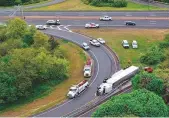 ?? AFP ?? A view from a drone shows a tractor-trailer overturned on the exit ramp in Bethpage.