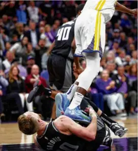  ?? SCOTT STRAZZANTE/SAN FRANCISCO CHRONICLE VIA AP ?? Draymond Green of the Warriors stomped on the Kings’ Domantas Sabonis in the fourth quarter of Game 2 Monday.