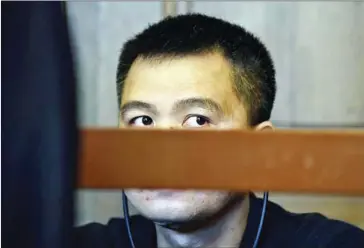  ?? TOBIAS SCHWARZ/AFP ?? A 47-year-old Vietnamese-Czech man, identified only as Long NH, sits on the bench prior his trial over the alleged kidnapping by secret agents of a Vietnamese ex-oil executive in Berlin, on Tuesday.