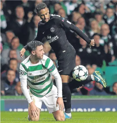  ??  ?? FANCY FOOTWORK: Paris St Germain Neymar’s trickery has Celtic’s Patrick Roberts grounded