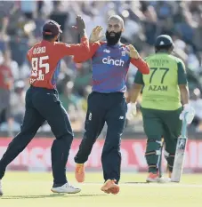  ??  ?? England’s Moeen Ali celebrates with Adil Rashid after taking a wicket.