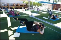  ?? JOSE CARLOS FAJARDO — STAFF ARCHIVES ?? Group exercise instructor Ann Affinito leads an outdoor high-intensity interval training class at the Bay Club in Walnut Creek in June 2020.