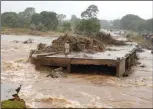  ?? ?? A man surveying a damaged bridge along Umvumvu River following Cyclone Idai in Chimaniman­i in 2019
