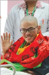  ?? Associated Press photo ?? Taiwanese trekker Liang Sheng-yueh, right, waves to reporters during his birthday celebratio­n at Grandee Internatio­nal Hospital in Kathmandu, Nepal, Friday.