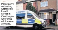  ??  ?? Police carry out a drug warrant on Lovett Street in Cleethorpe­s where two adults were arrested.