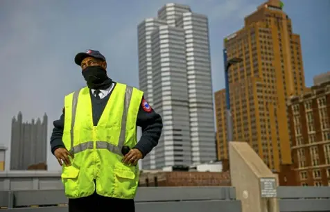  ?? Steve Mellon/Post-Gazette ?? Security worker Tony Tolten on the top floor of the First Avenue Garage, where he once stopped a distraught woman from jumping. “People think all security officers do is sit around around look at cameras. No, we have to interact with the public.”