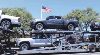  ?? — Reuters ?? Toyota trucks are shown on a car carrier for delivery after arriving in the United States in National City, California.