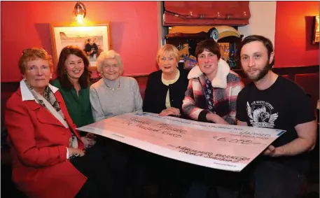  ?? Photo by Declan Malone ?? Tom Kavanagh and Joanne Devane (right) presenting a cheque for €6,000 on behalf of the West Kerry Tractor Run to Phil O’Riordan, Maria O’Mahony, Nora Curran and Mary O’Donnell of West Kerry Care of the Aged, in the Marina Inn on Saturday night.