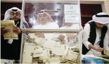  ??  ?? KUWAIT: Officials count votes after polling stations closed their doors yesterday. — Photos by Yasser Al-Zayyat