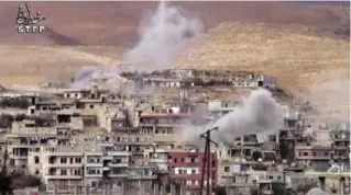  ??  ?? DAMASCUS: This file frame grab from a video provided by a Syrian opposition media outlet shows smoke rise from the government forces shelling on Wadi Barada, northwest of Damascus. —AP