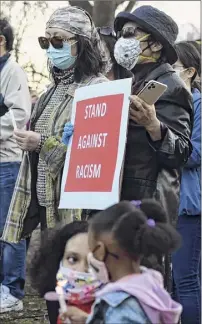  ??  ?? Hundreds gathered in Academy Park to draw attention to a nationwide increase in hate crimes against Asian Americans and Pacific Islanders.